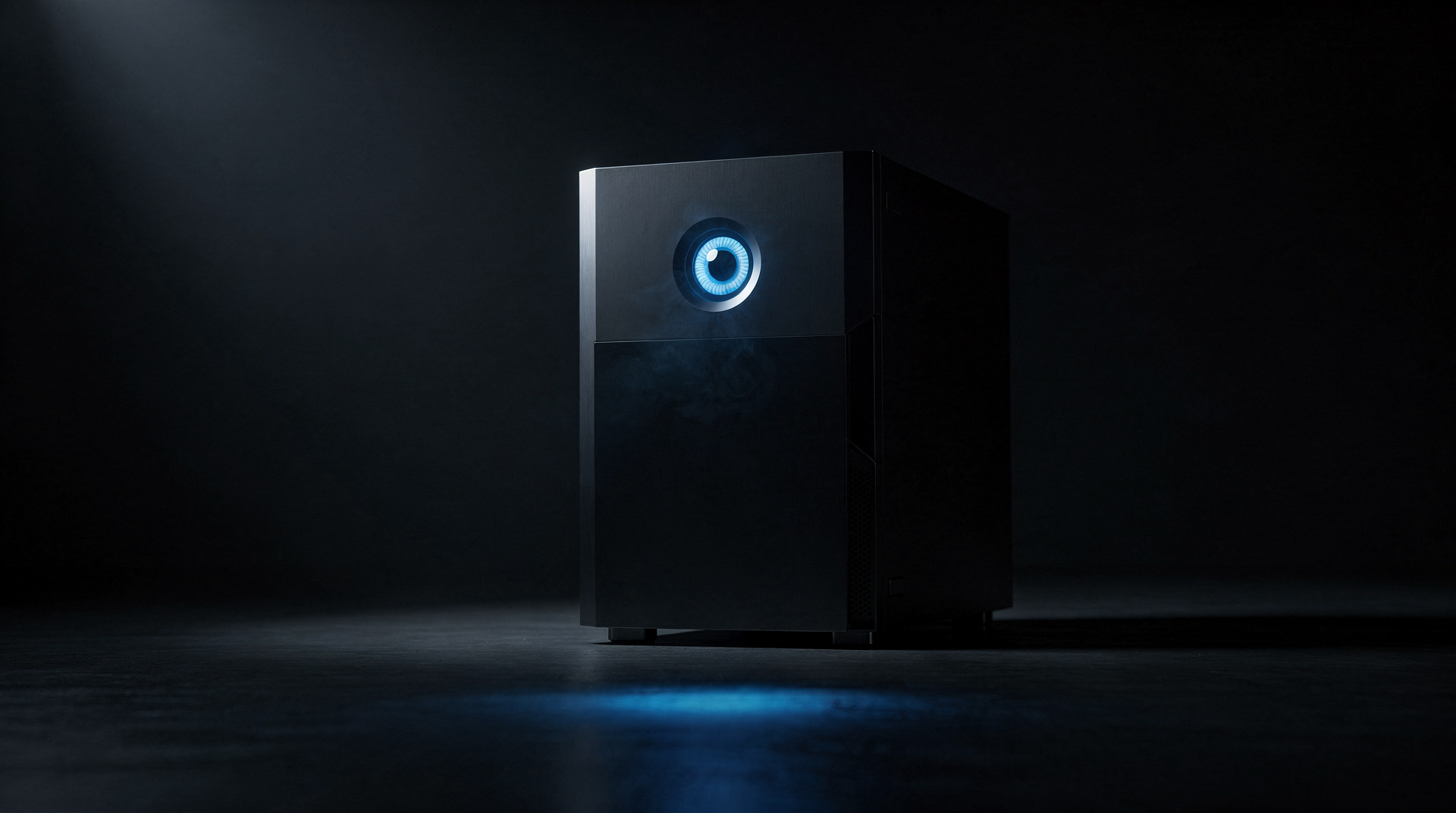 A clean black machine with a single glowing azure aperture, in a dark void.